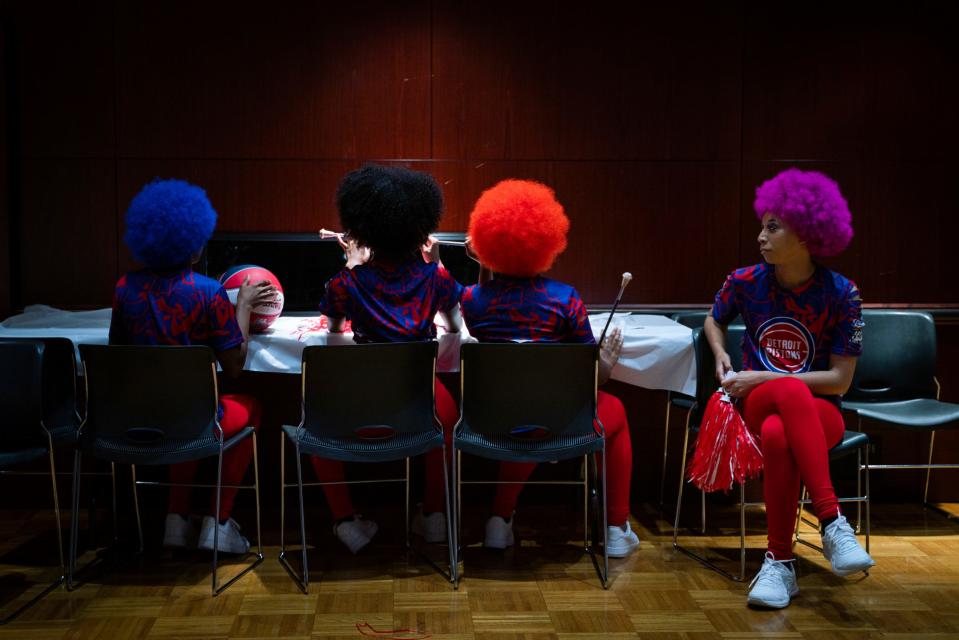Dajahne Duncan, 23, Detroit, right, gets ready with a group of models representing Little Willie's hair salon during the Hair Wars and Hot Cars runway show at Ford Community and Performing Arts Center in Dearborn on Sunday, Sept. 18, 2022.