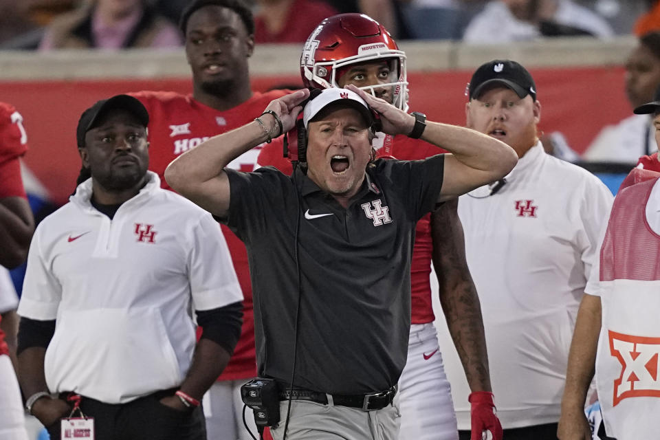 Houston coach Dana Holgorsen yells at the officials during the second half of an NCAA college football game against Oklahoma State Saturday, Nov. 18, 2023, in Houston. Oklahoma State won 43-30. (AP Photo/David J. Phillip)