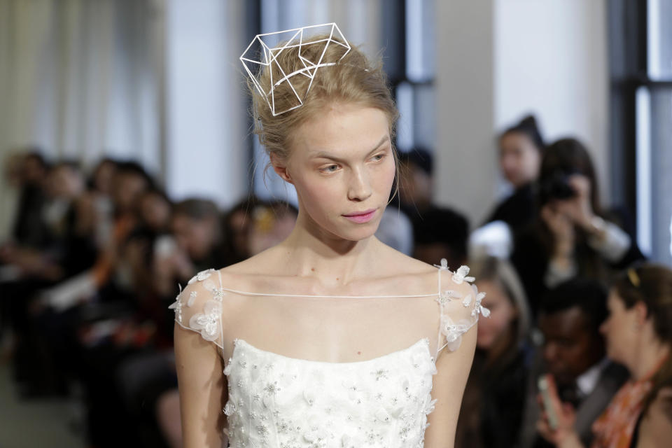 A bridal collection by Angel Sanchez is modeled in New York, Monday, April 22, 2013. (AP Photo/Seth Wenig)