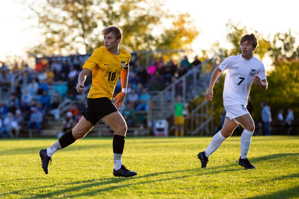 East's Caleb Swartzendruber looks for the ball as he readies for the pass Tuesday, Oct. 4, 2022, at Zeeland East High School.