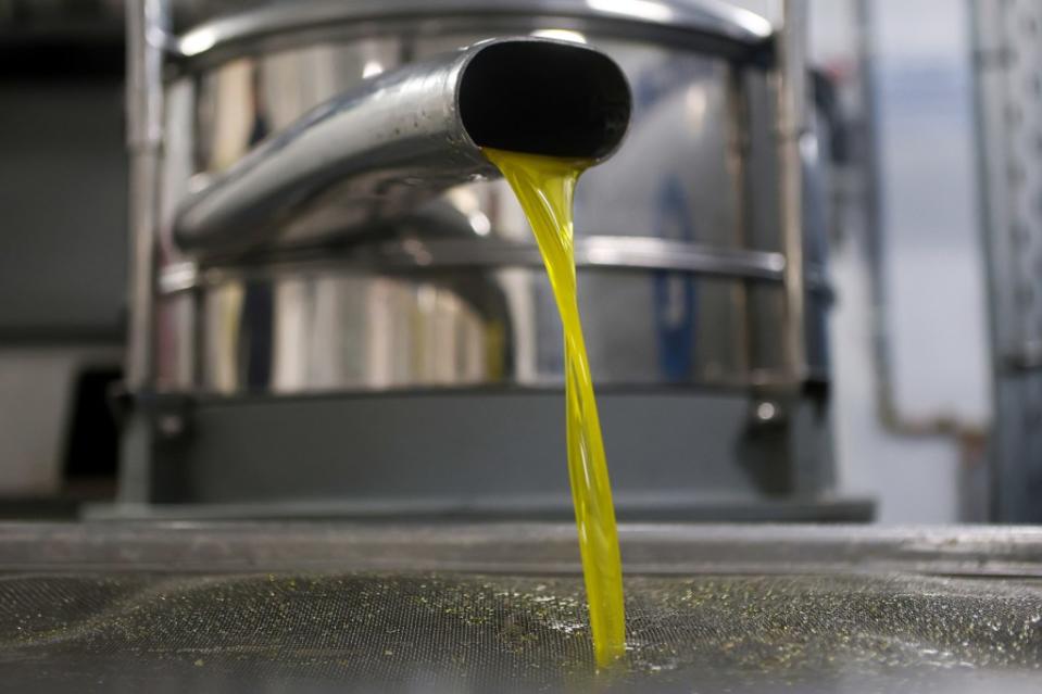 Sipping one or two tablespoons of olive oil early in the morning on an empty stomach is especially beneficial. ELIAS MARKOU/EPA-EFE/Shutterstock