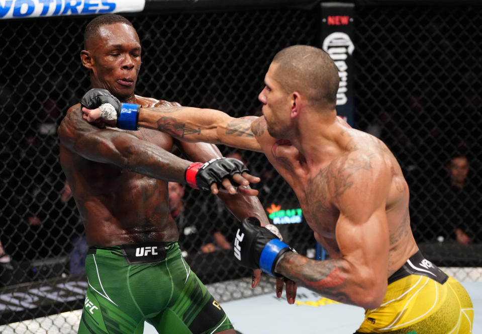 NEW YORK, NEW YORK – NOVEMBER 12: (R-L) Alex Pereira of Brazil punches Israel Adesanya of Nigeria in the UFC middleweight championship bout during the UFC 281 event at Madison Square Garden on November 12, 2022 in New York City. Photo by Jeff Bottari/Zuffa LLC.