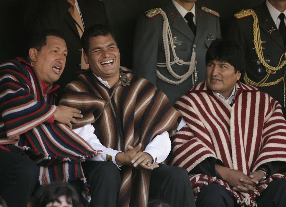 FILE - In this Jan. 14, 2007 file photo, Venezuela's President Hugo Chavez, from left, Ecuador's President-elect Rafael Correa and Bolivian President Evo Morales attend a Mass in Zumbahua, Ecuador. A European and U.S.-trained economist, Correa was enough of a pragmatist to never seriously challenge dollarization even while identifying himself as a "21st century socialist." For the first time in a decade, Correa won’t be running when Ecuadoreans go to the polls on Sunday, Feb. 19, 2017, to elect his successor. (AP Photo/Fernando Llano, File)