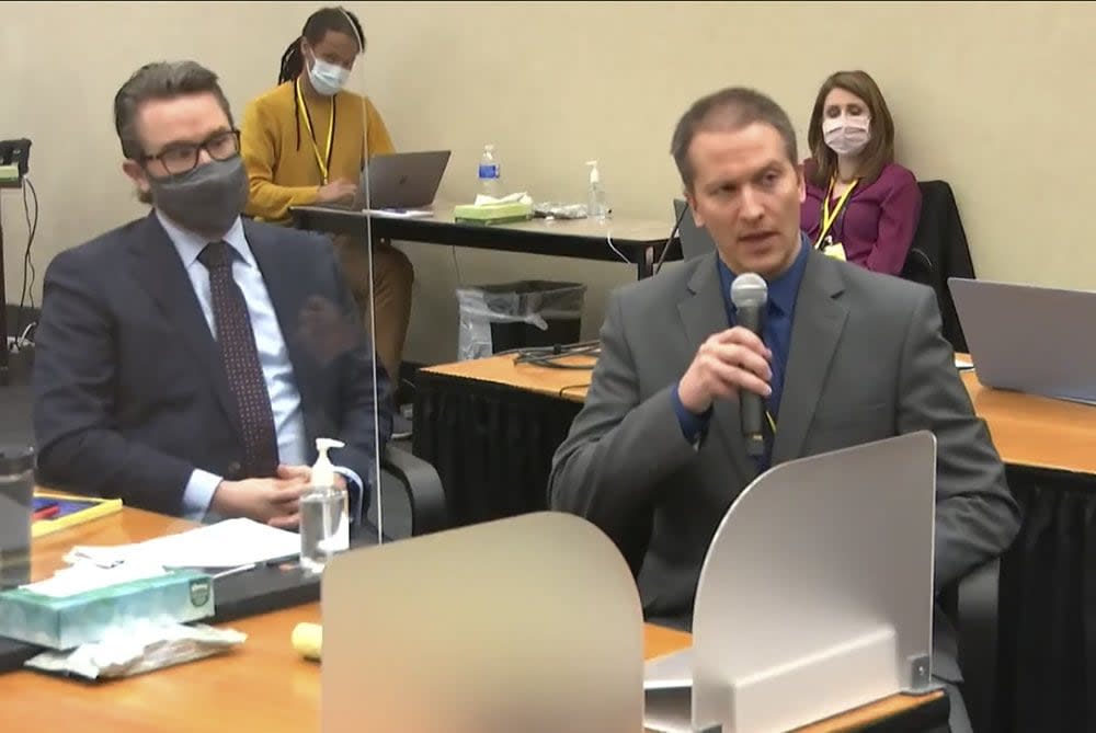 Defense attorney Eric Nelson, left, and defendant, former Minneapolis police officer Derek Chauvin address Hennepin County Judge Peter Cahill during motions before the court Thursday, April 15, 2021, in the trial of Chauvin, at the Hennepin County Courthouse in Minneapolis. Chauvin is charged in the May 25, 2020 death of George Floyd. (Court TV via AP, Pool)