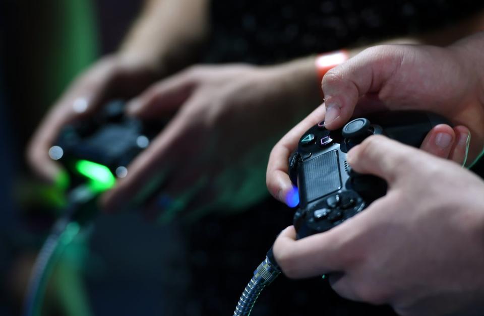 Gamers play on a Playstation 4 during EGX 2016 at the NEC in Birmingham (Joe Giddens/PA) (PA Archive)