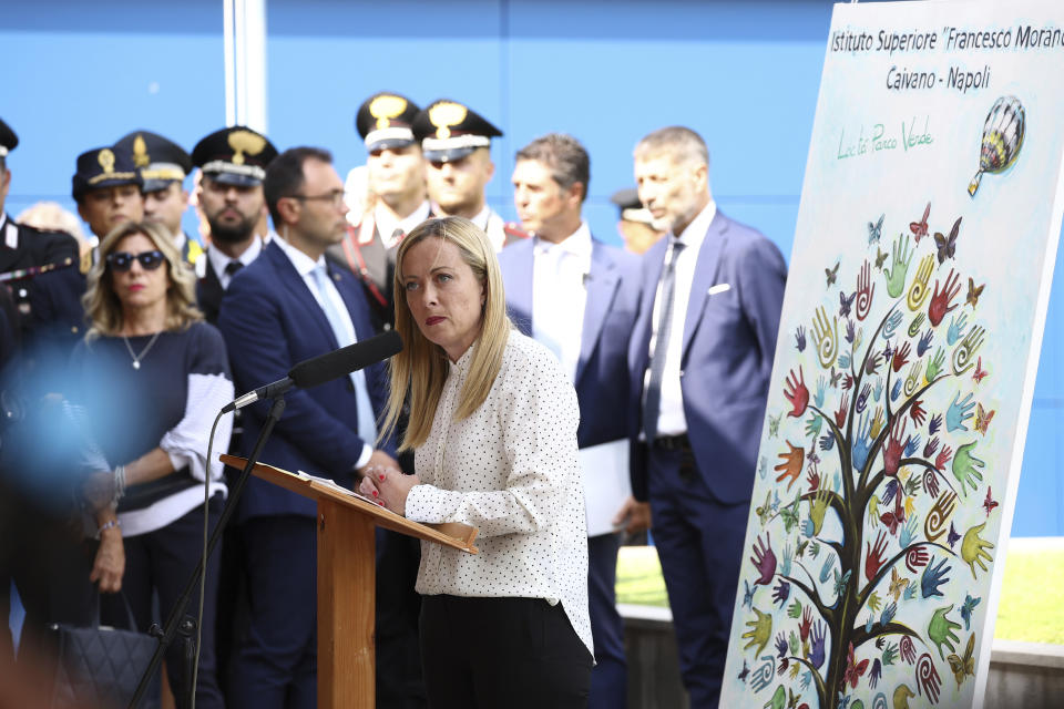 Italy's Prime Minister Giorgia Meloni speaks during a visit to the Green Park neighbourhood in Caivano, Italy, Thursday Aug. 31, 2023. (Alessandro Garofalo/LaPresse via AP)