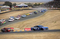 Kyle Larson (5) leads the field during a NASCAR Cup Series race, Sunday, June 6, 2021, at Sonoma Raceway in Sonoma, Calif. (AP Photo/D. Ross Cameron)