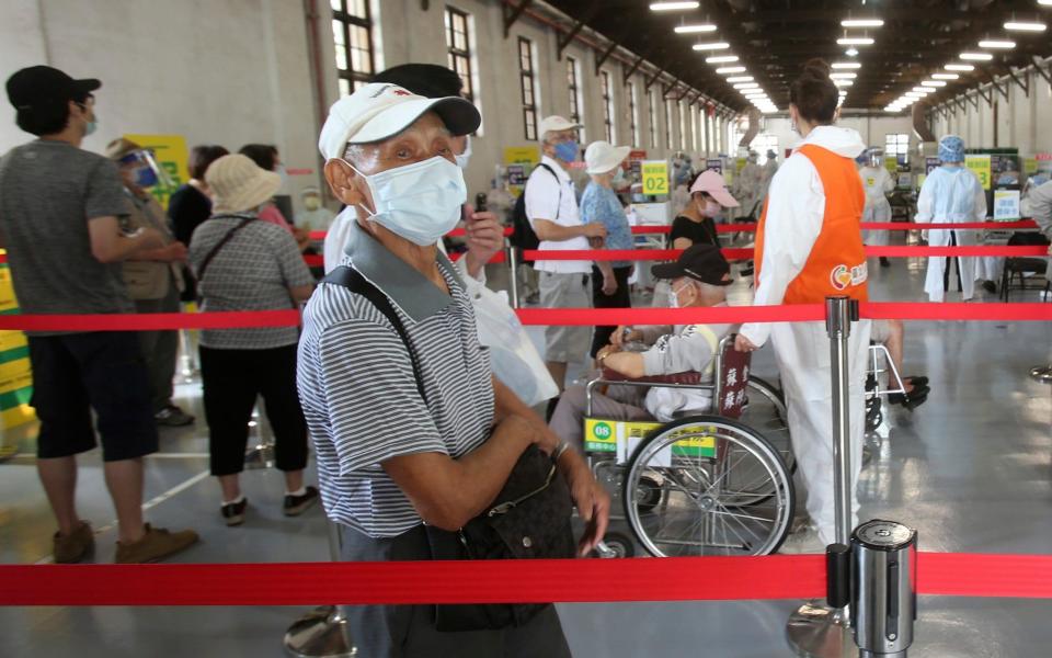 Elderly Taiwanese people wait to receive shots of the AstraZeneca COVID-19 vaccine at Songshan Cultural and Creative Park in Taipei, Taiwan, Wednesday, June 16, 2021.  - AP