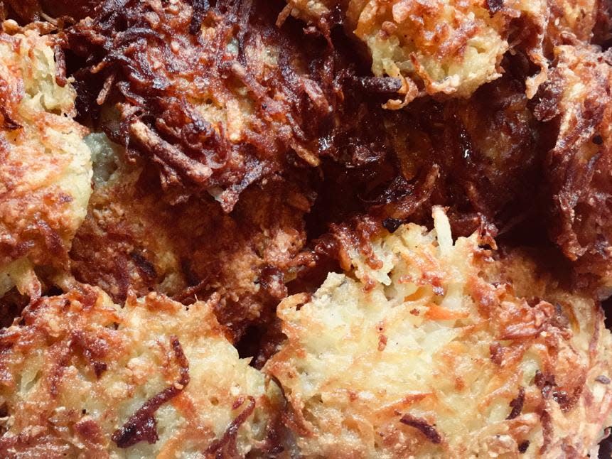 A close up photo of homemade latkes.