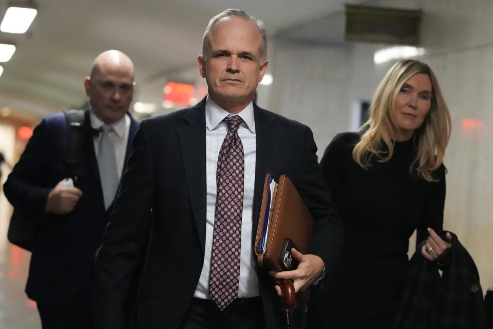 Steve Bannon's attorneys John, center, and Susan Carman, right, arrive at Manhattan Supreme Court, Tuesday, Feb. 28, 2023, in New York. (AP Photo/Mary Altaffer)