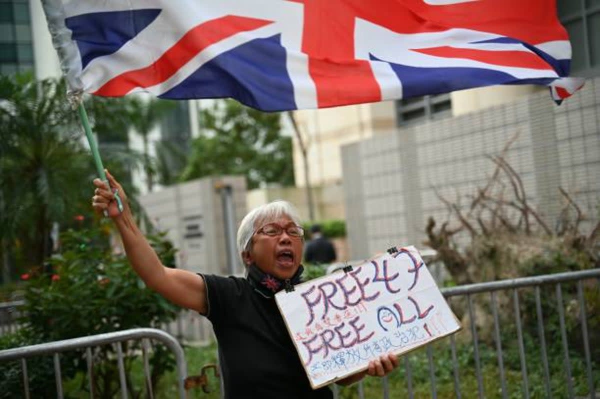 Pro-democracy activist known as Grandma Wong protests outside the court where Hong Kong's largest national security trial against 47 pro-democracy activists started its final argum ents on  29 November, 2023  (AFP via Getty Images)