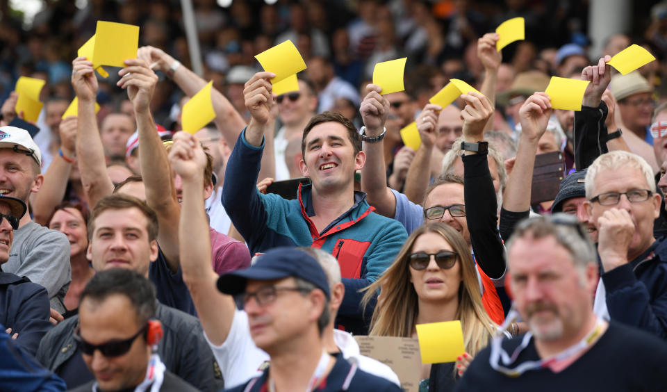 BIRMINGHAM, ENGLAND - AUGUST 01: England fans show off their yellow sandpaper during day one of the First Specsavers Ashes Test Match between England and Australia at Edgbaston on August 01, 2019 in Birmingham, England. (Photo by Stu Forster/Getty Images)