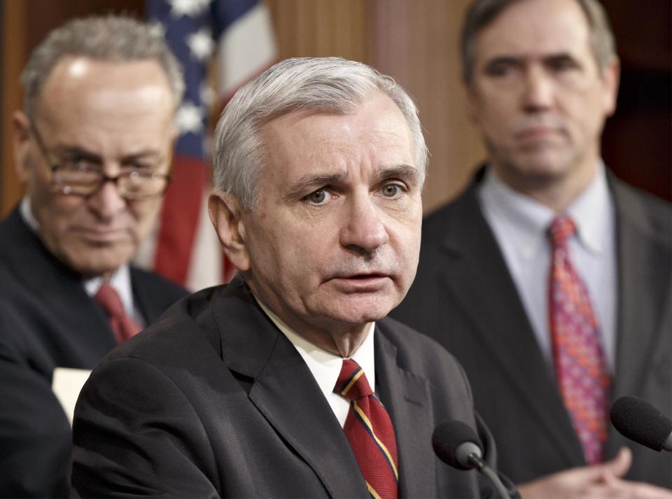Sen. Jack Reed, D-R.I., center, joined by Sen. Charles Schumer, D-N.Y., left, and Sen. Jeff Merkley, D-Ore., right, meets with reporters on Capitol Hill in Washington, Tuesday, Jan. 7, 2014, after legislation to renew jobless benefits for the long-term unemployed unexpectedly cleared an initial Senate hurdle. White House-backed Legislation to renew jobless benefits for the long-term unemployed unexpectedly cleared an initial Senate hurdle on Tuesday, but the bill's fate remained in doubt. The vote was 60-37 to limit debate on the legislation, with a half-dozen Republicans siding with the Democrats on the test vote. (AP Photo/J. Scott Applewhite)