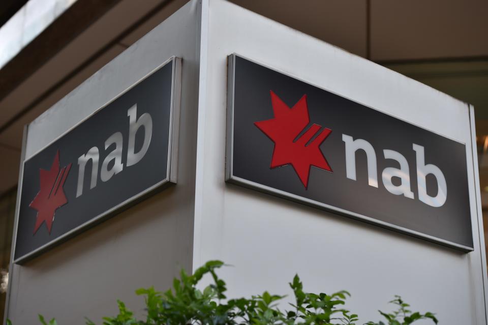 A logo of National Australia Bank is seen out their office in the central business center of Sydney on May 7, 2015.  National Australia Bank announced the country's biggest ever rights issue to raise 4.4 billion USD while detailing plans to demerge its British banking business. AFP PHOTO / Saeed Khan        (Photo credit should read SAEED KHAN/AFP via Getty Images)