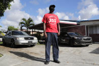 James Jackson poses for a photograph outside his home during the coronavirus pandemic, Thursday, July 30, 2020, in West Park, Fla. Jackson is among the tens of thousands hospitality workers fighting for survival in the age of the pandemic. Jackson's employer, the Diplomat Beach Resort, in Hollywood, Fla., was forced to close in March because of the outbreak. (AP Photo/Lynne Sladky)