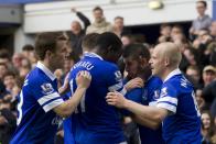 Everton's Kevin Mirallas, centre right, celebrates with teammates after scoring against Arsenal during their English Premier League soccer match at Goodison Park Stadium, Liverpool, England, Sunday April 6, 2014. (AP Photo/Jon Super)