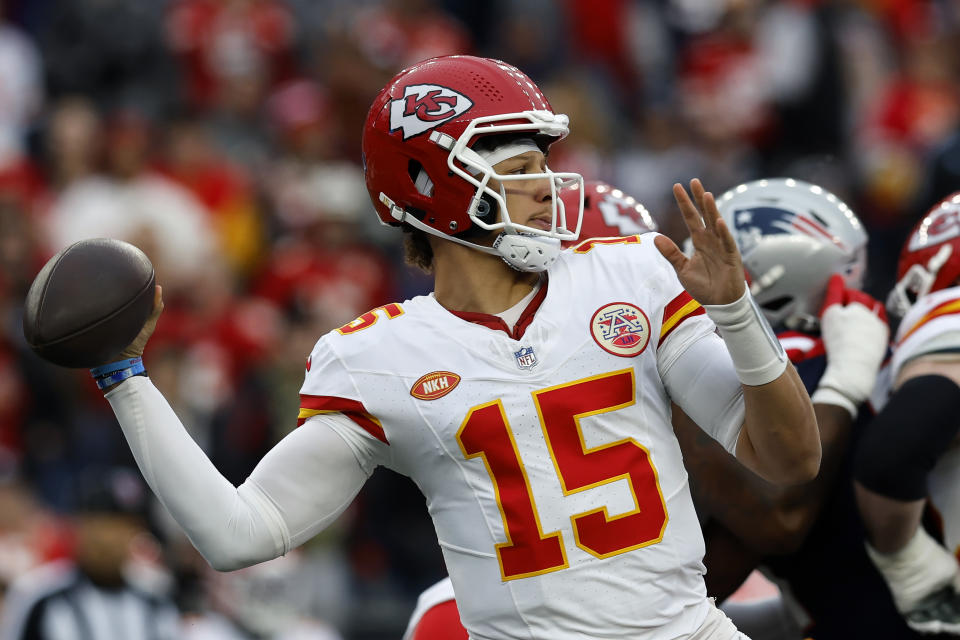 Kansas City Chiefs quarterback Patrick Mahomes (15) winds up to pass during the first half of an NFL football game against the New England Patriots, Sunday, Dec. 17, 2023, in Foxborough, Mass. (AP Photo/Michael Dwyer)