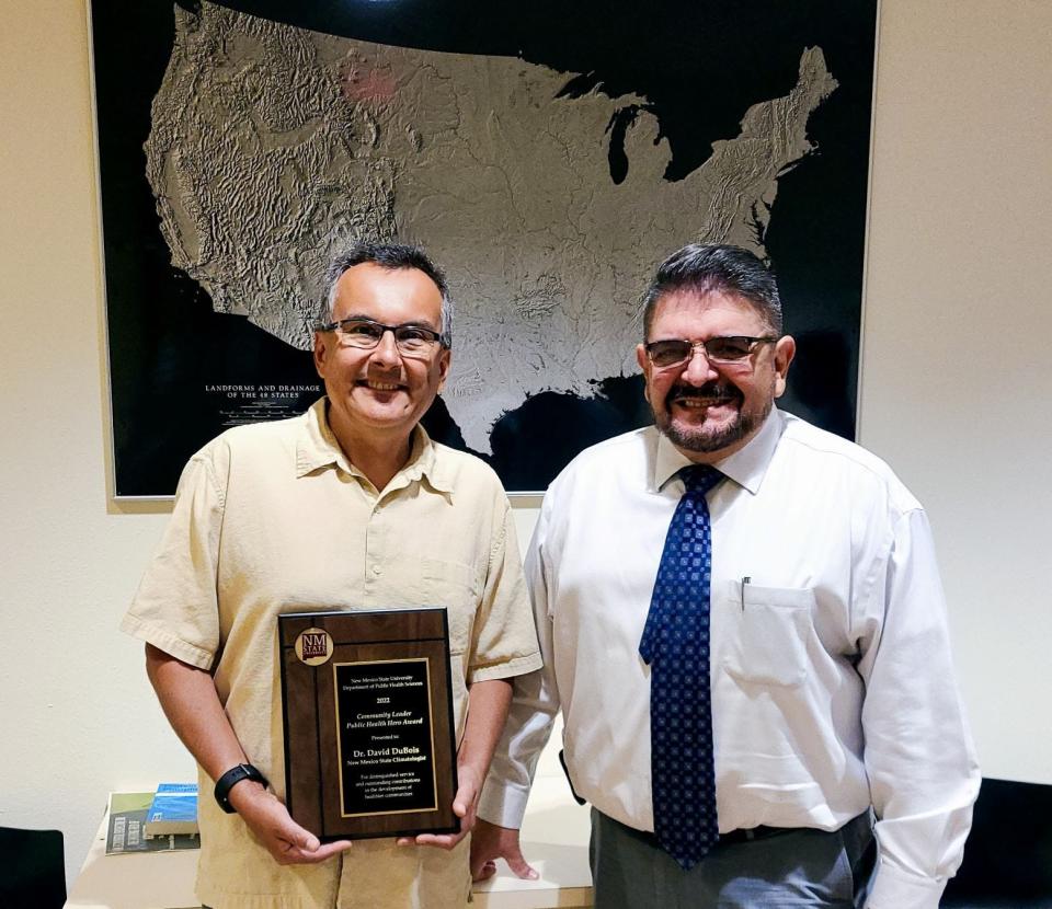 David DuBois, state climatologist for New Mexico, receives the Community Leader Public Health Hero Award from New Mexico State University’s Department of Public Health Sciences. DuBois stands with Héctor Luis Díaz, head of NMSU’s Department of Public Health Sciences.