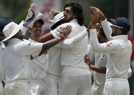 India's Ishant Sharma (C) celebrates with his teammates after taking the wicket of Sri Lanka's Lahiru Thirimanne (not pictured) during the third day of their third and final test cricket match in Colombo , August 30, 2015. REUTERS/Dinuka Liyanawatte