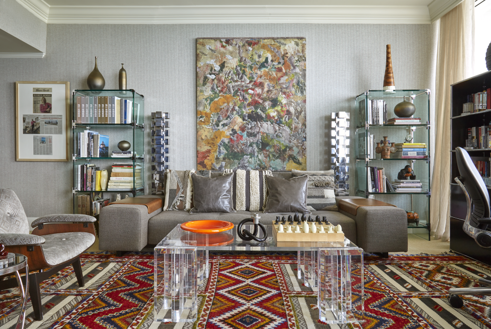 Assure Interiors planned this space in response to the client's favorite art and antique pieces.