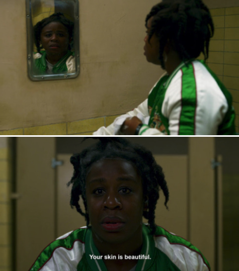 "Crazy Eyes" looking at her reflection in the mirror and telling herself her skin is beautiful