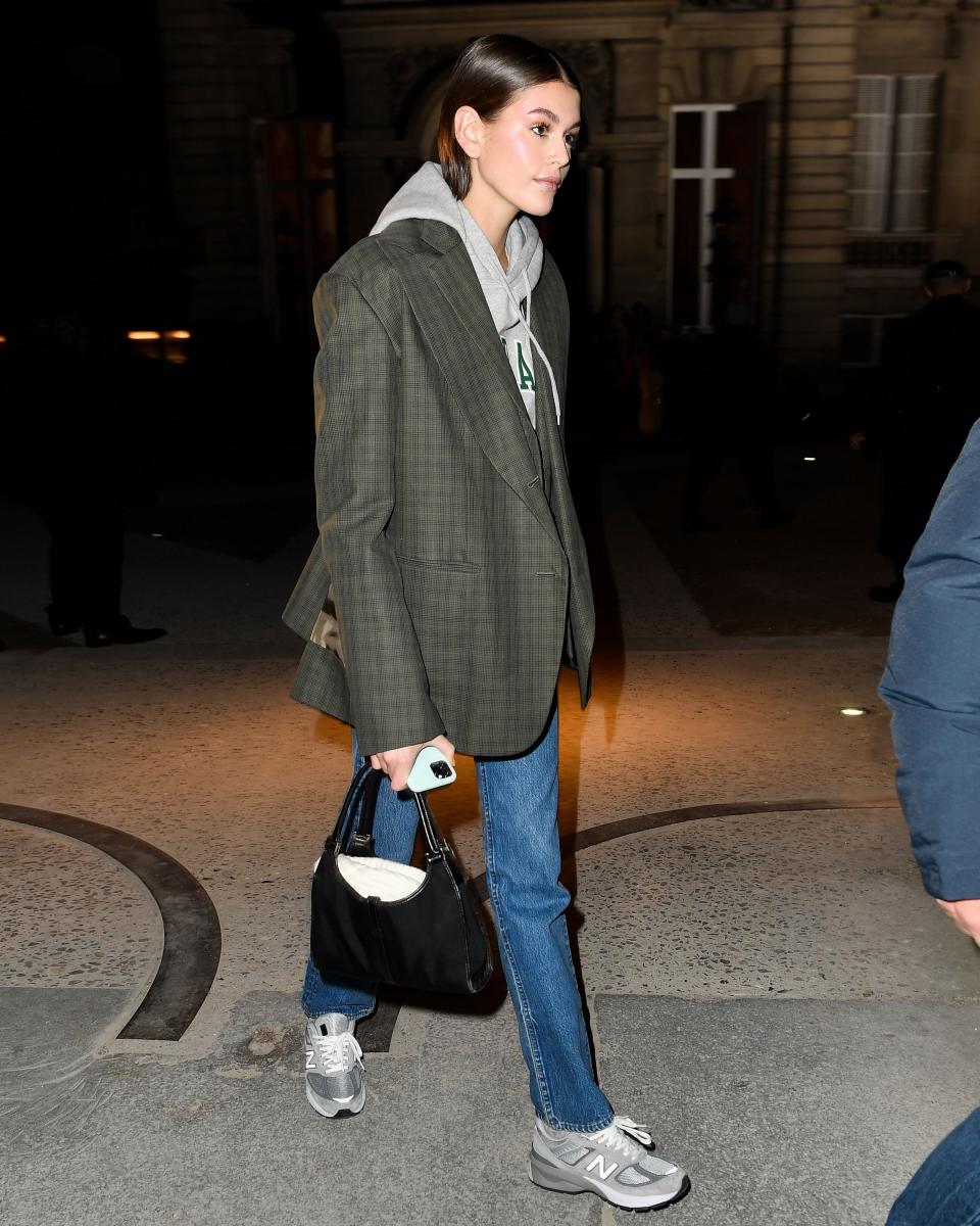 Blazer over a hoodie and New Balance 990s? Kaia Gerber has righteous dad style.