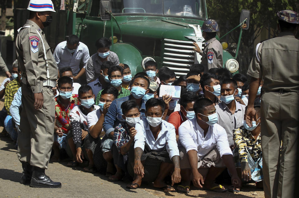 Prisoners, soon to be released marking the 74th anniversary of Myanmar's Union Day, wait for processing at the Insein prison in Yangon, Myanmar Friday, Feb. 12, 2021. Myanmar's coup leader used the country's Union Day holiday on Friday to call on people to work with the military if they want democracy, a request likely to be met with derision by protesters who are pushing for the release from detention of their country's elected leaders. (AP Photo)