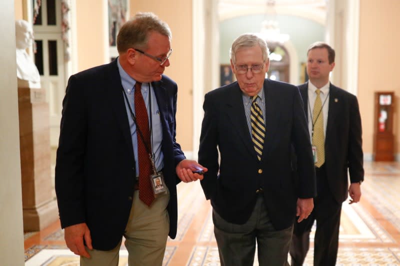 Senate Majority Leader McConnell walks to the Senate Chamber ahead of a vote on Capitol Hill in Washington