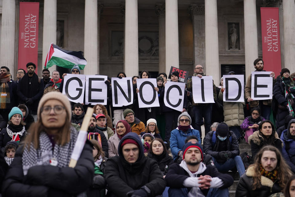 Protesters hold up banners, flags and placards in front of the national Gallery in Trafalgar Square during a demonstration in support of Palestinian people in Gaza, in London, Saturday, Jan. 13, 2024.(AP Photo/Alberto Pezzali)