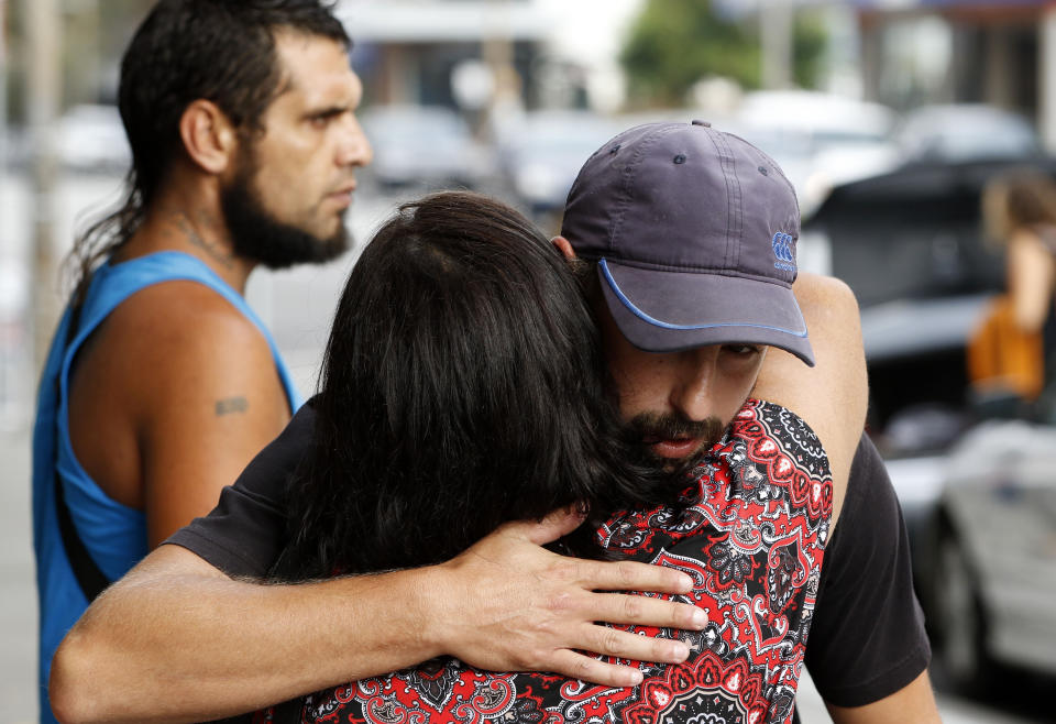 Family and friends of victim Ricky Slater-Dickson hug each other outside of court in March. Source: AAP