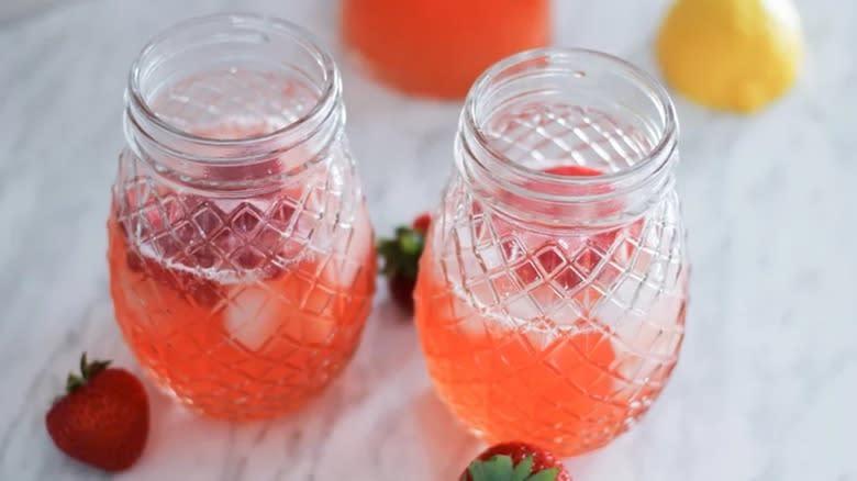 strawberry lemonade in jar glasses