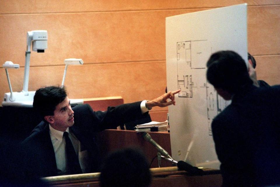 Dr. Ed Friedland points to a blueprint of his home while being questioned by his attorney, David Rudolf, on Sept. 22, 1997. A jury hearing Friedland’s wrongful-death lawsuit found Marion Gales responsible for the 1990 stabbing death of Kim Thomas. The case remains unsolved.