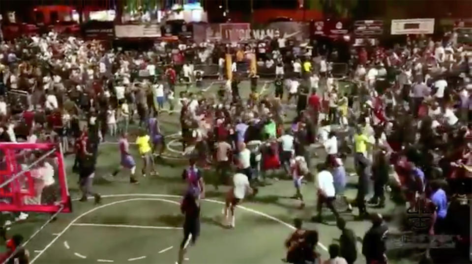 Fans mob D’Angelo Russell after making a clutch shot at Dyckman Park in New York City. (Screen shot via @IamDyckman)
