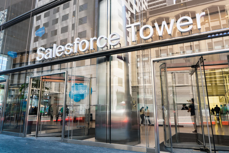 Salesforce logo is visible in the lobby and reflected on the facade of the Salesforce Tower entrance.