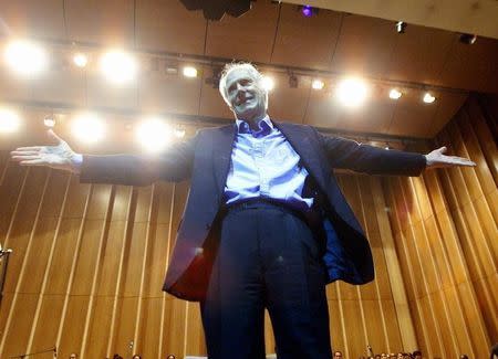 Legendary producer of "The Beatles", Sir George Martin, gestures after conducting the Cuban National Symphony Orchestra, November 1, 2002, in Havana. REUTERS/Rafael Perez