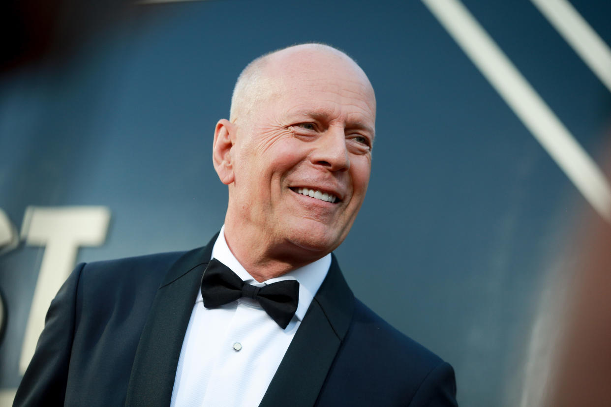 bruce willis wearing black tuxedo and white shirt smiling on red carpet, Bruce Willis has been diagnosed with frontotemporal dementia (FTD), his loved ones announced