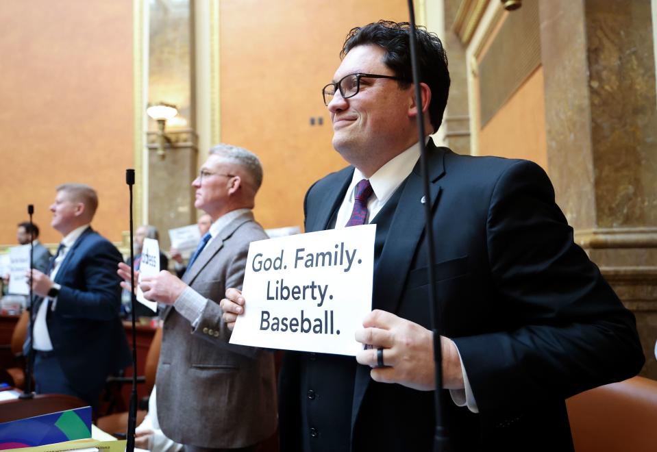 Rep. Ryan Wilcox, R-Ogden, holds up a sign showing his “why” for being a state representative on the first day of the general legislative session in the House chamber at the Capitol in Salt Lake City on Tuesday, Jan. 16, 2024. | Kristin Murphy, Deseret News