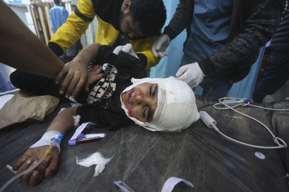 Palestinians wounded in the Israeli bombardment of the Gaza Strip are brought to a hospital in Rafah, Monday, Dec. 11, 2023. (AP Photo/Hatem Ali)