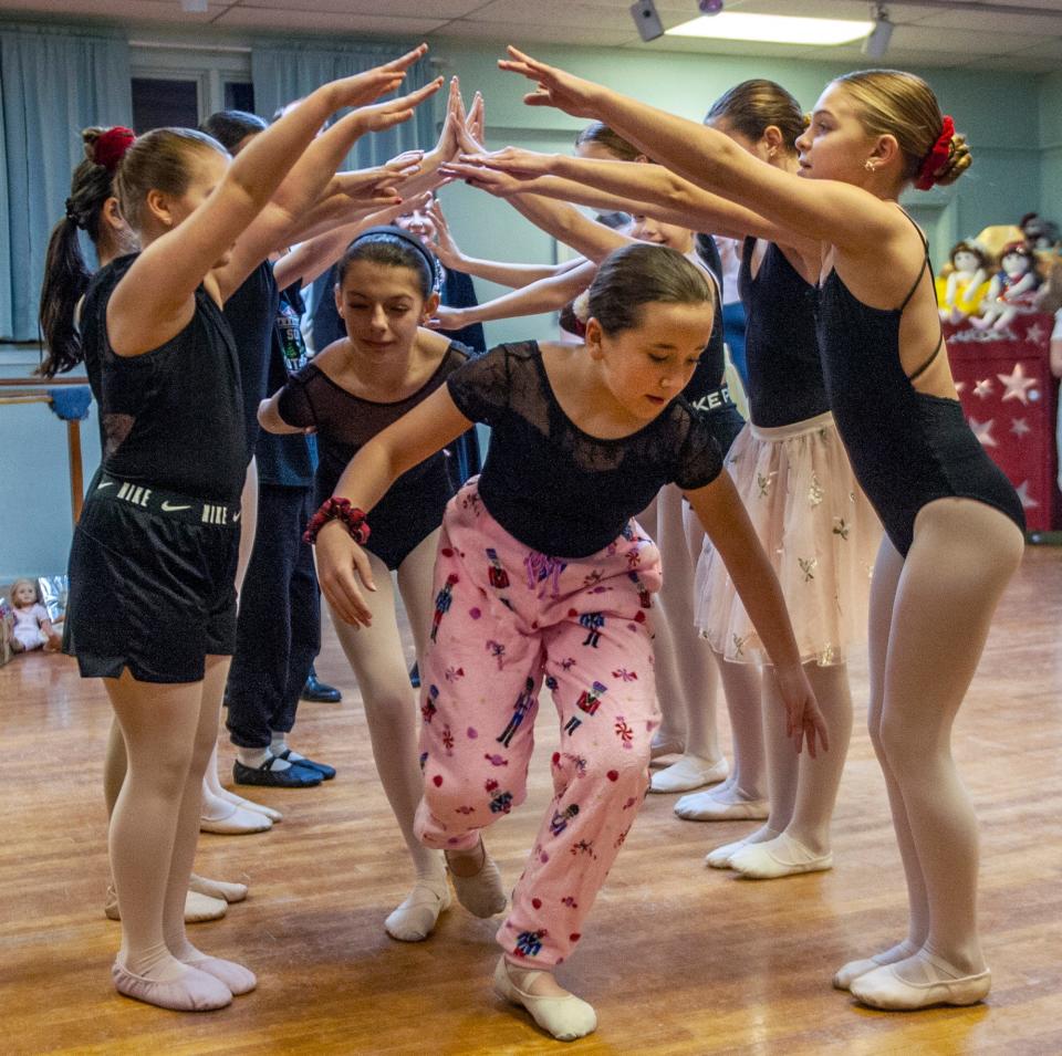 Emma Cullen center, takes part in a rehearsal of "The Nutcracker" at the Deane School of Dance in Mendon, Dec. 11, 2023. The Greater Milford Ballet is putting on two performances of the holiday classic this weekend in the Milford High School Auditorium.