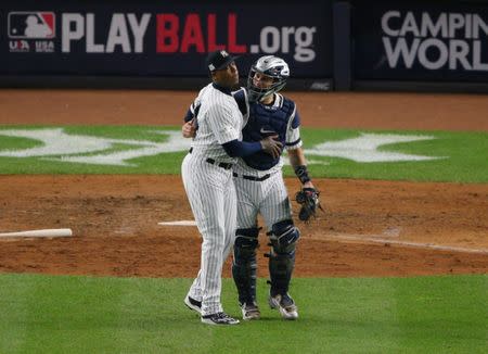 Oct 17, 2017; Bronx, NY, USA; New York Yankees relief pitcher Aroldis Chapman (54) and designated hitter Gary Sanchez (24) celebrate after defeating the Houston Astros in game four of the 2017 ALCS playoff baseball series at Yankee Stadium. Mandatory Credit: Brad Penner-USA TODAY Sports