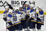 St. Louis Blues' Mike Hoffman (68) celebrates his winning goal with teammates during overtime of an NHL hockey game against the Los Angeles Kings, Friday, March 5, 2021, in Los Angeles. (AP Photo/Marcio Jose Sanchez)