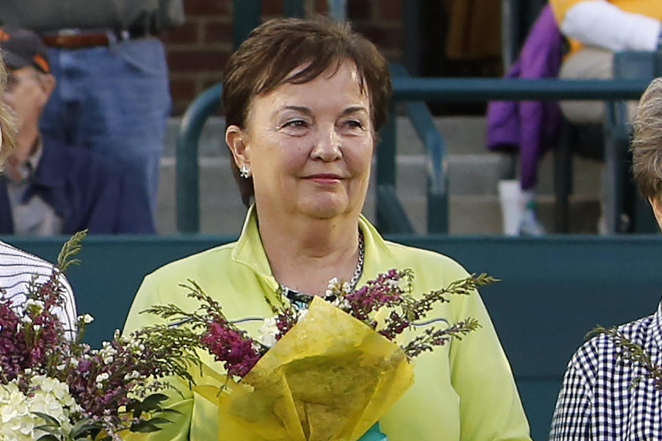 FILE - In this April 7, 2012, file photo, Kerry Melville Reid, a member of the original nine women who helped start the women's professional tennis tour, is honored at the Family Circle Cup tennis tournament in Charleston, S.C. It’s the 50th anniversary of Billie Jean King and eight other women breaking away from the tennis establishment in 1970 and signing a $1 contract to form the Virginia Slims circuit. That led to the WTA Tour, which offers millions in prize money. (AP Photo/Mic Smith, File)