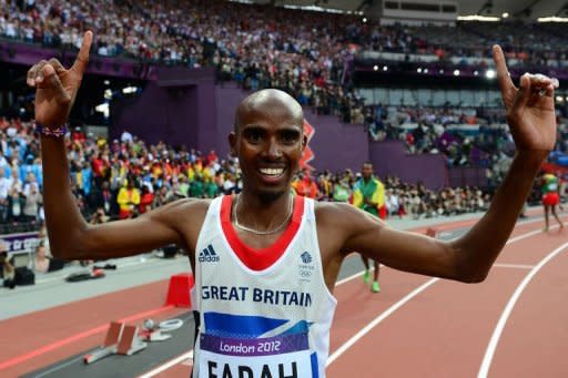 Britain's Mo Farah celebrates after winning the gold medal in the men's 5000m final at the athletics event of the London 2012 Olympic Games