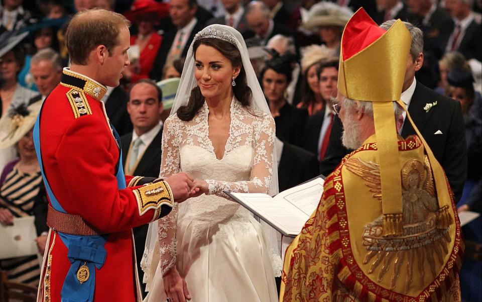 Prince William and Kate Middleton exchange rings in front of the Archbishop of Canterbury during their wedding at Westminster Abbey, on April 29, 2011  - AFP PHOTO / WPA POOL / Dominic Lipinski