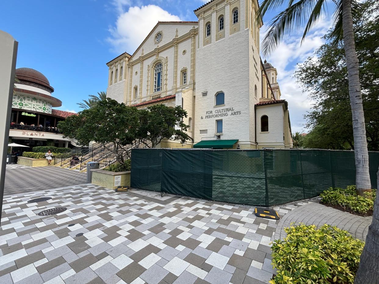 Fencing outside the Harriett Himmel Theatre at The Square in West Palm Beach was put up in late March as work surrounding the building and interior continues.