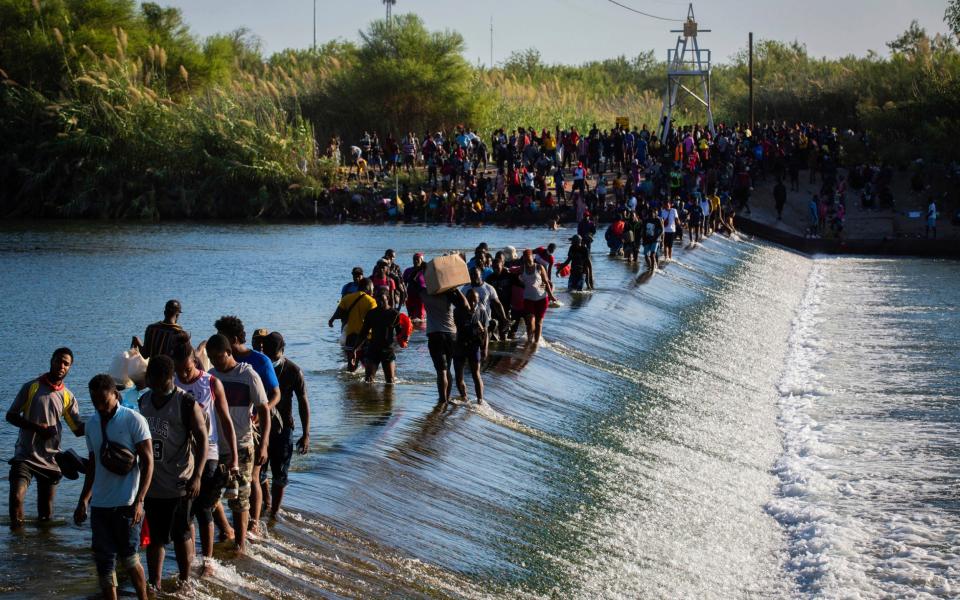 Haiti migrants waiting to get access to the United States cross the Rio Grande - Marie D. De Jesa/Houston Chronicle 