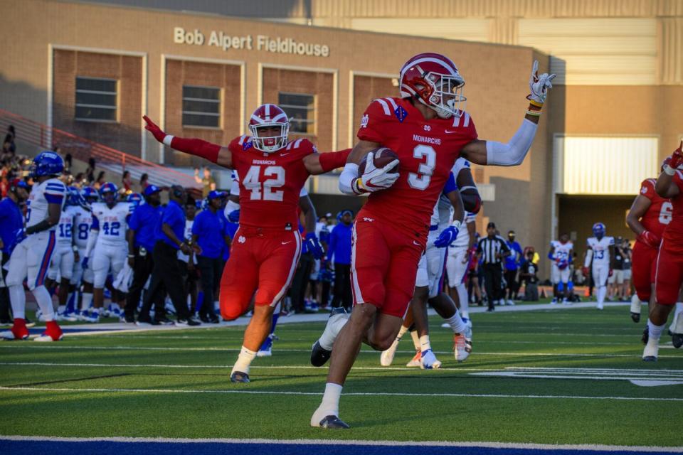 Domani Jackson returns an interception for a touchdown while a senior at Mater Dei High during a game at Duncanville, Texas.