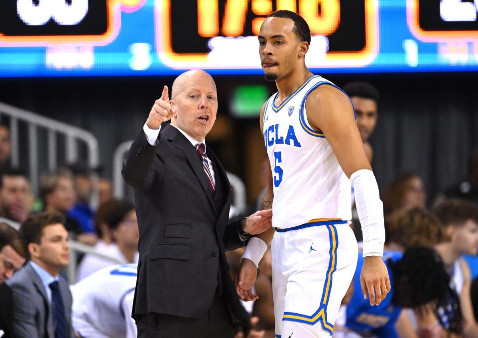 UCLA coach Mick Cronin instructs guard Amari Bailey during the first half of the team's game against Washington at Pauley Pavilion presented by Wescom.