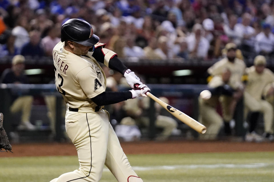 Arizona Diamondbacks' Christian Walker connects for a run-scoring double against the Chicago Cubs during the fourth inning of a baseball game Saturday, Sept. 16, 2023, in Phoenix. (AP Photo/Ross D. Franklin)