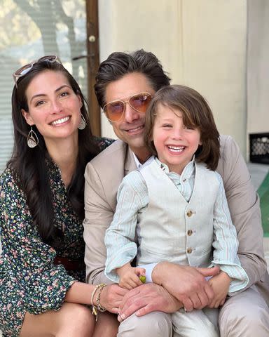 <p>John Stamos Instagram</p> (L-R) Caitlin McHugh Stamos and John Stamos are pictured with their son Billy in 2022.